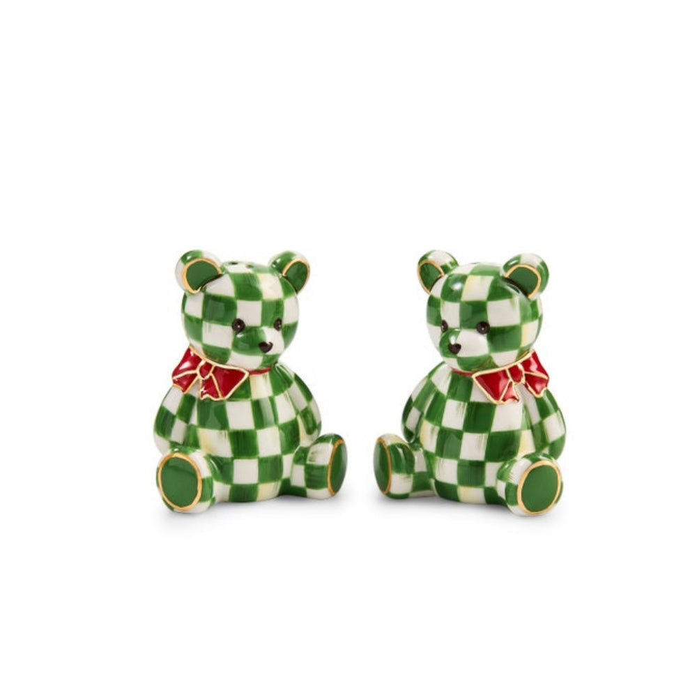 A pair of small teddy bear figurines for salt and pepper shakers, in a green and white checkered pattern, each wearing a red bow tie, set against a plain white background.