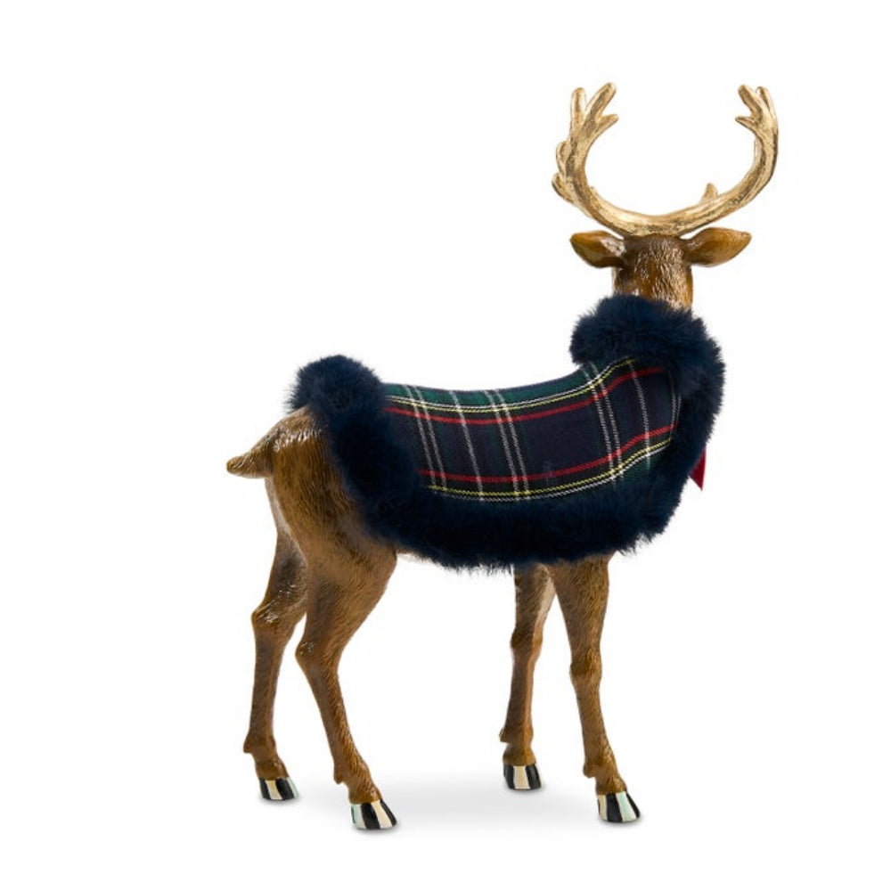 A decorative reindeer figurine wearing a navy blue faux-fur trimmed plaid winter coat with red, yellow, and green tartan lines, shown on a plain white background.