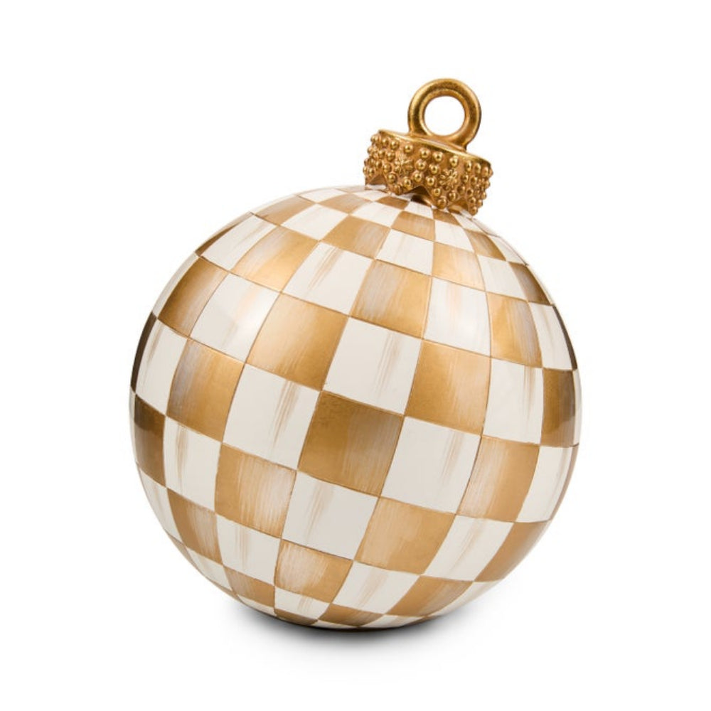 A spherical Christmas ornament featuring a gold and white checkerboard pattern, with a textured gold cap and hanging loop at the top, shown on a plain white background.