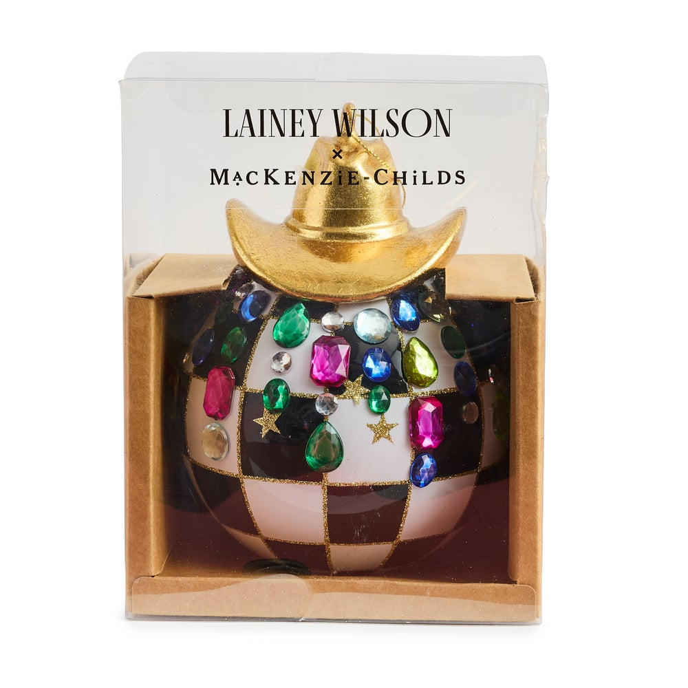 Courtly Check ornament with a gold cowboy hat on top and colorful gems in packaging on a white backround. 