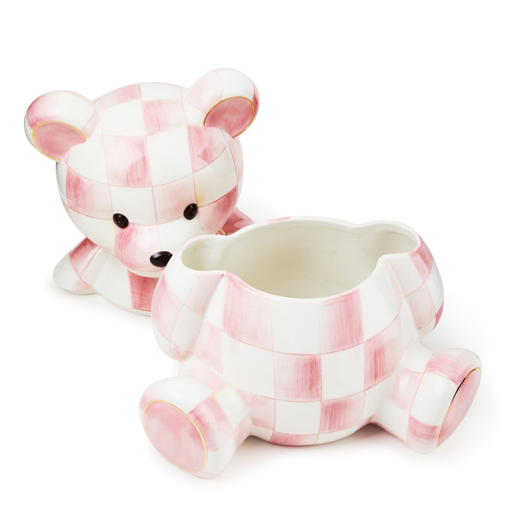 Pink and white checkered bear-shaped planter on a white background