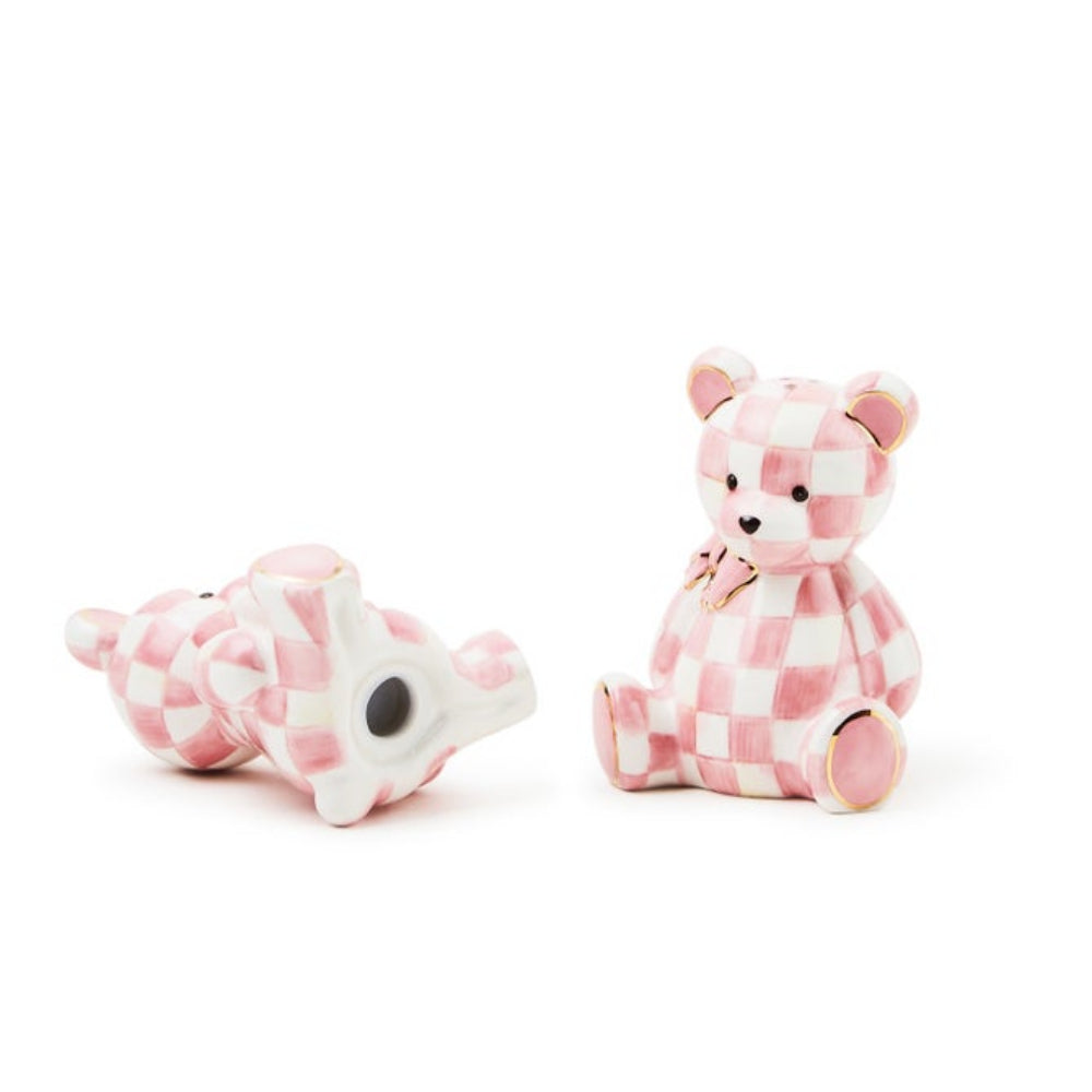 Two checkered animal toys on a white background.