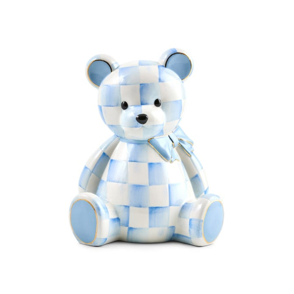 A ceramic teddy bear figurine with a light blue and white checkered pattern, sitting against a solid white background.