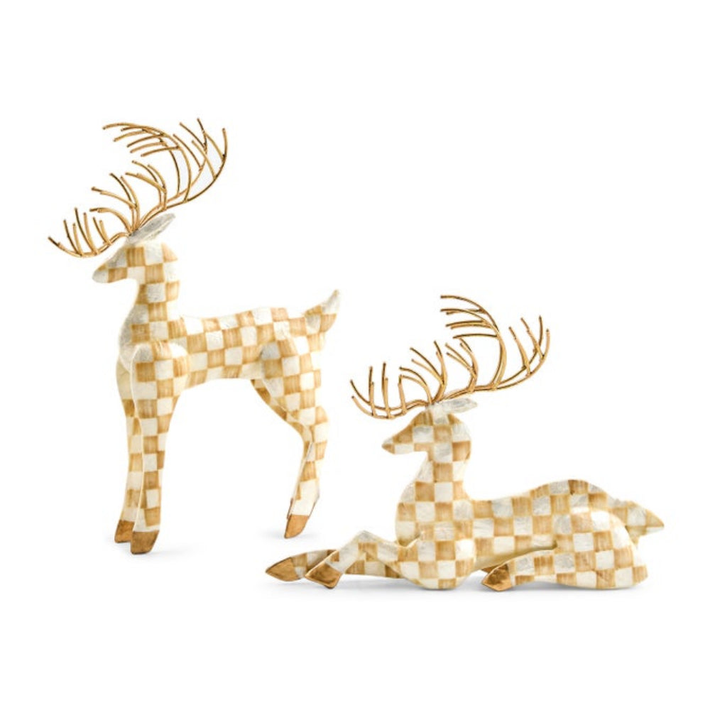 Two decorative reindeer figurines with a beige and white checkered pattern and metallic gold antlers, shown standing and sitting on a white background.