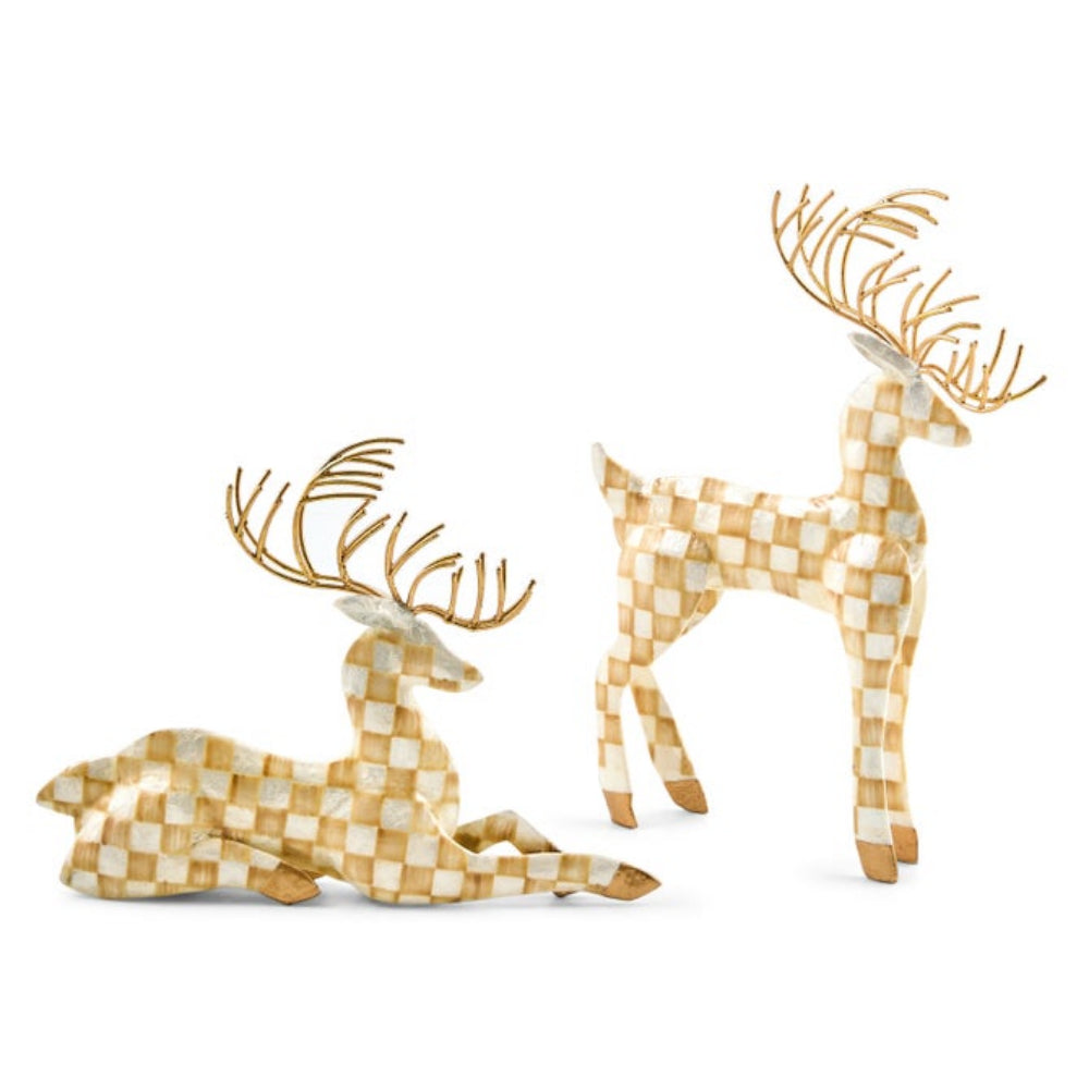 Two decorative reindeer figurines with a checkered gold and white pattern and metallic gold antlers, shown on a plain white background.
