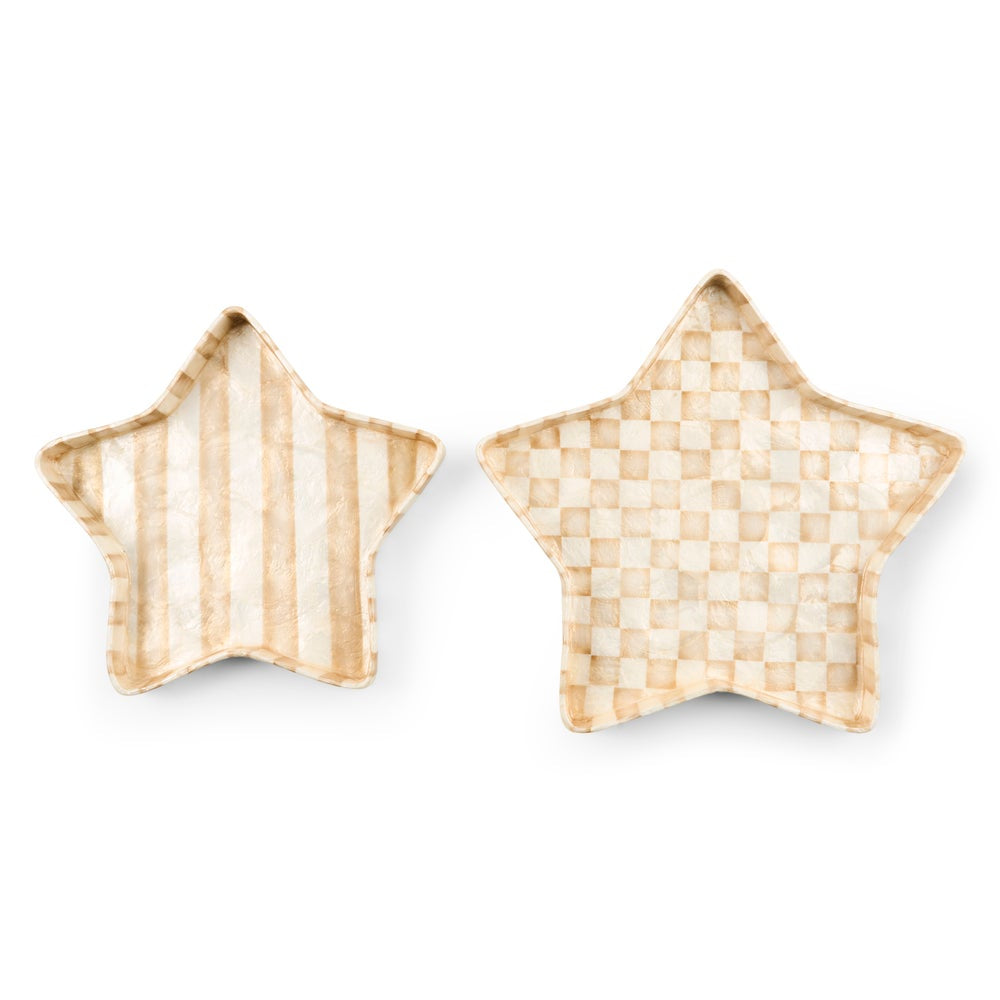 Two star-shaped decorative trays on a white background, one with vertical beige and cream stripes and the other with a beige and cream checkerboard pattern.