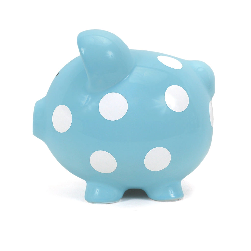 Blue piggy bank with white polka dots on a white background. 
