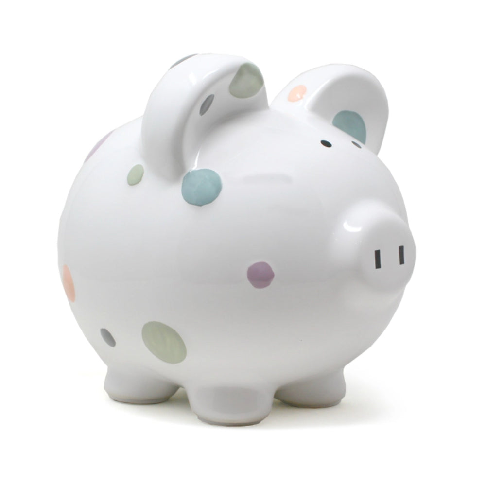 White piggy bank with colorful polka dots on a white background