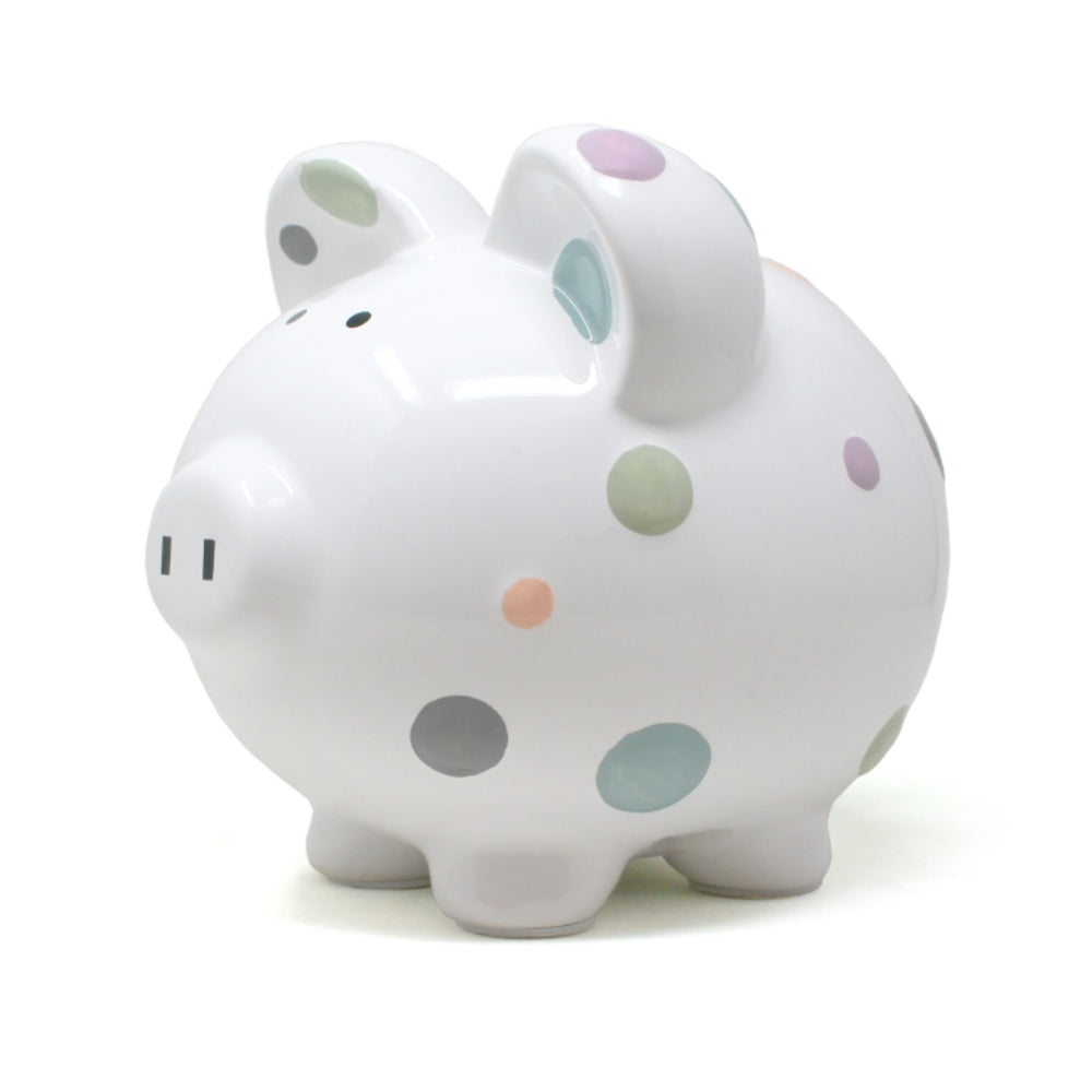 Right side photo od a white piggy bank with colorful polka dots on a white background