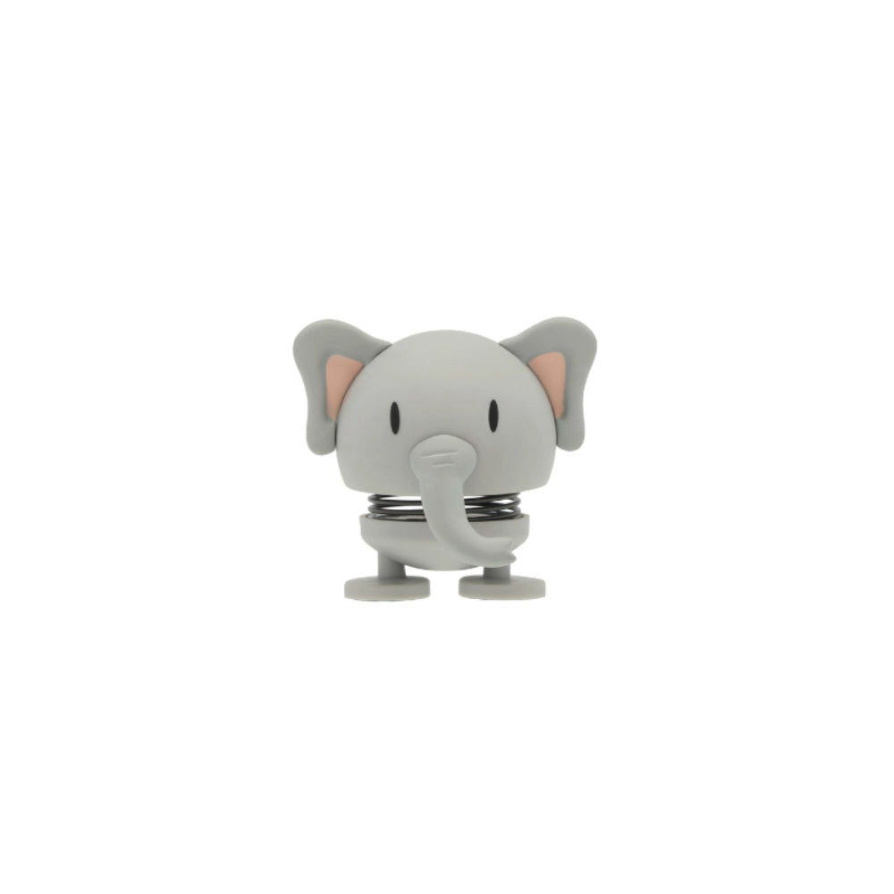 A small gray elephant figurine on white backround