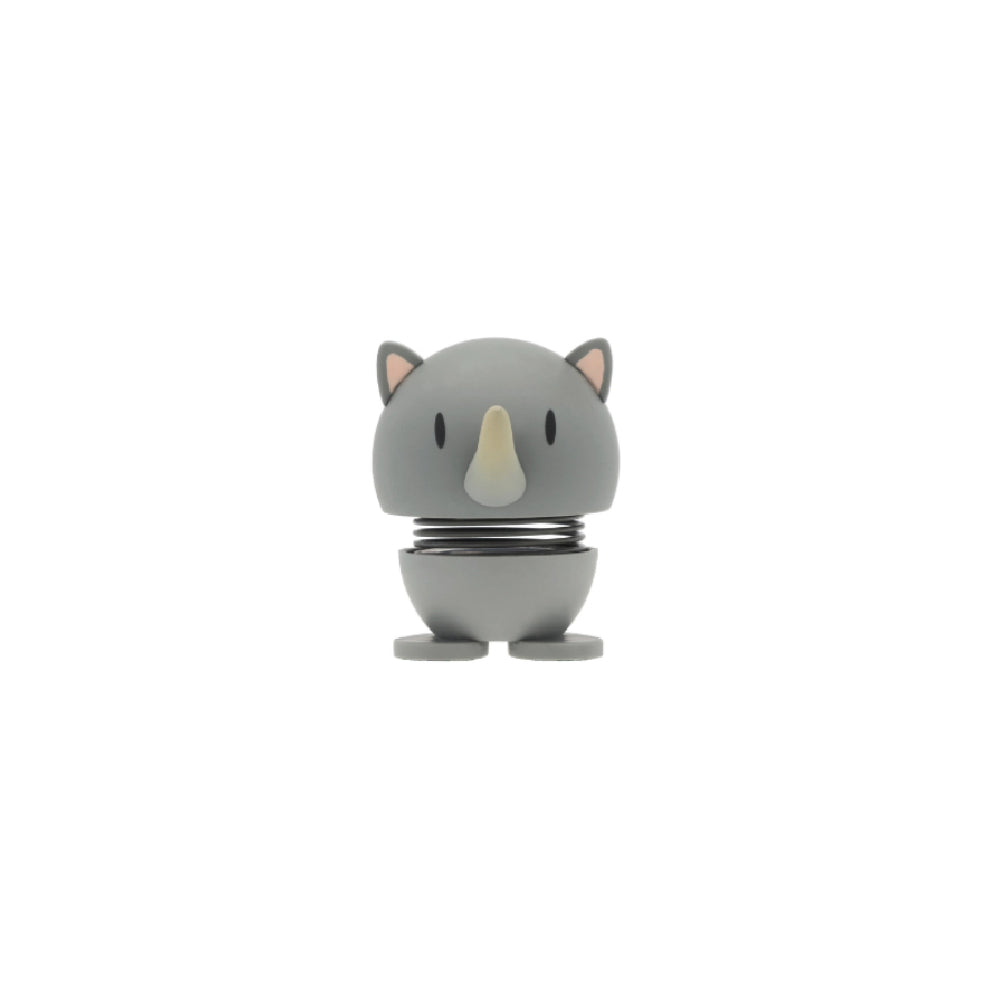 Grey rhino shaped figurine with a spring on a white background