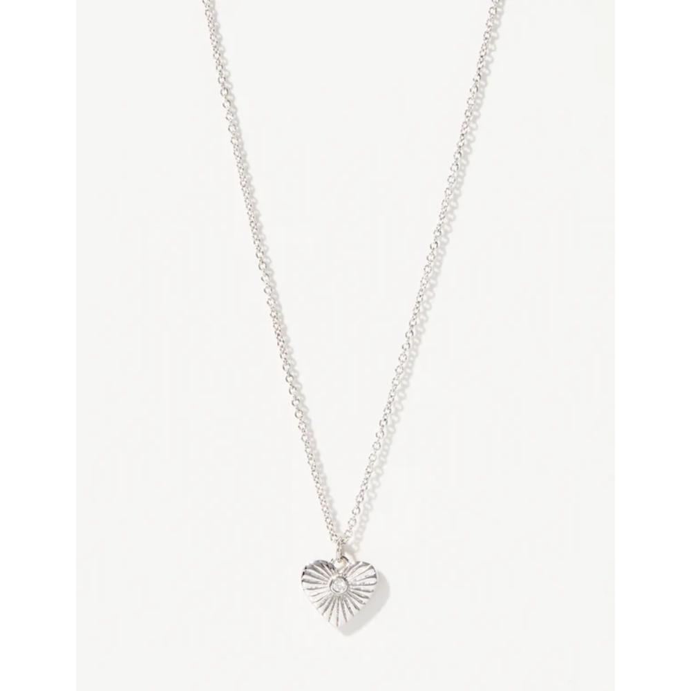 A silver chain necklace with a textured, sunburst-style heart pendant, displayed against a clean white background.