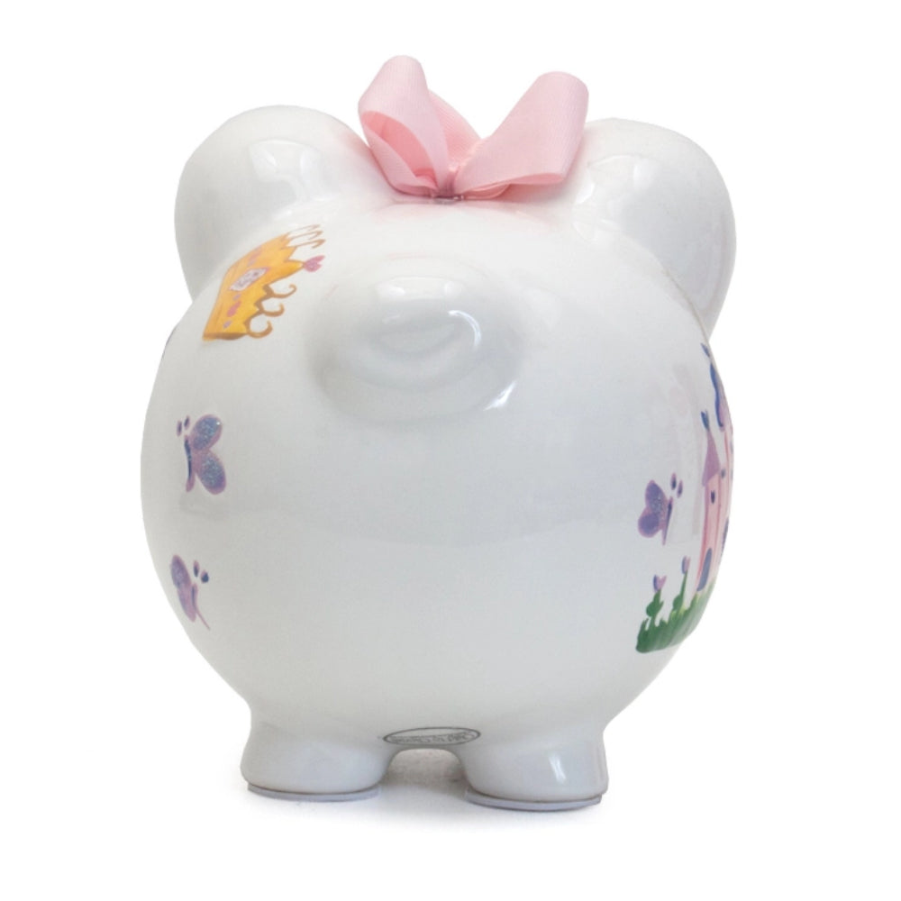 A Princess Castle Piggy Bank with a castle, butterflies, hearts, a crown,  and a pink bow on a white background.