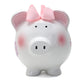 A white ceramic piggy bank with pink and purple butterfly decorations, pink ears, and a pink bow on top.