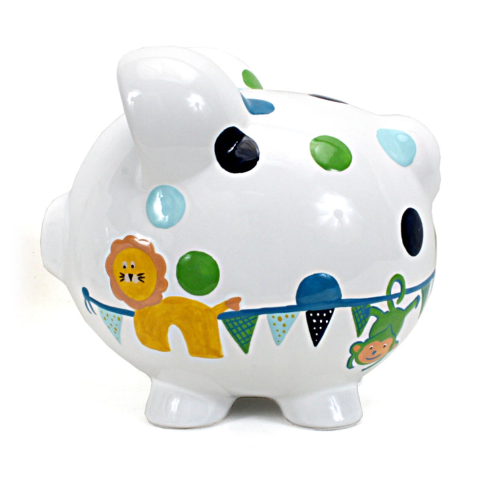 right side of a piggy bank with colorful polka dots and patterns with a lion and green monkey on a white background