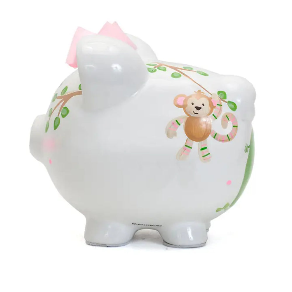 Left side of a white piggy bank with brown monkey design on a white background