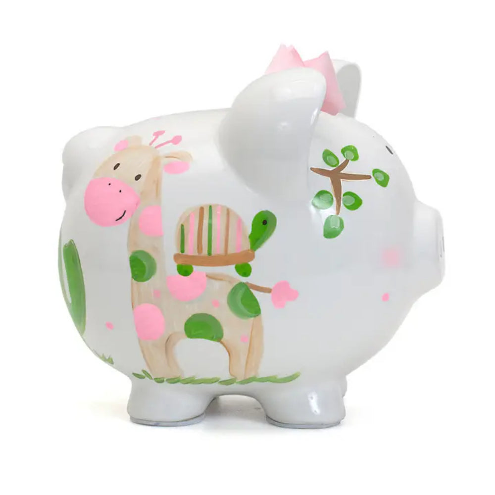 Right side photo of a white piggy bank with a colorful giraffe and turtle design on a white background