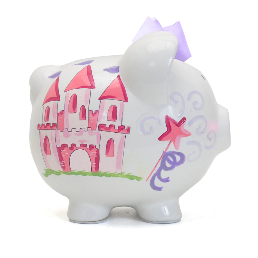 Right side photo of a white piggy bank with a pink castle design and a purple bow on a white background