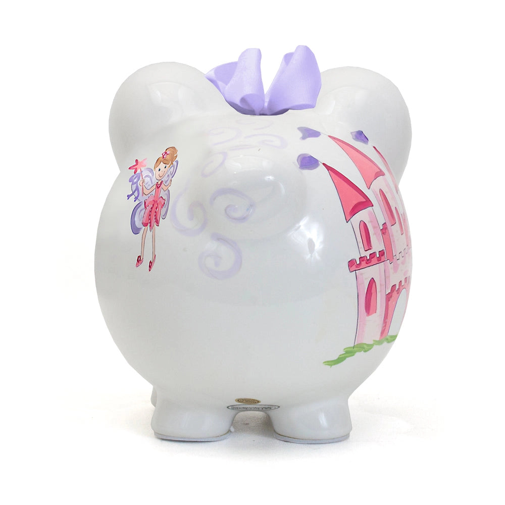 Back photo o a piggy bank with fairy and castle design on a white background