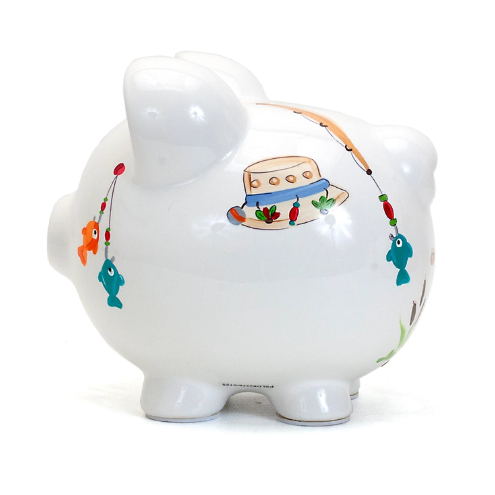 A fishing piggy bank on a white background with fishes and a fishers hat. 