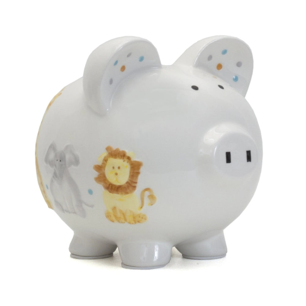 White piggy bank with lion and elephant designs on a white background