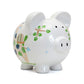 White piggy bank with colorful designs on a white background