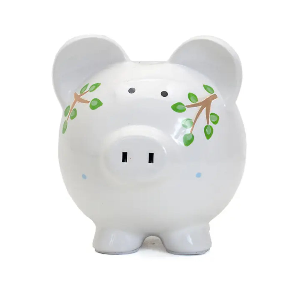  Photo of the front of a white piggy bank with plant designs on a white background