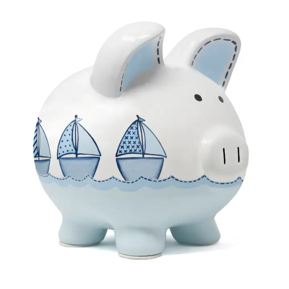Piggy bank with sailboat design on a white background