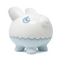 White piggy bank with blue accents and a sailboat design on a white background