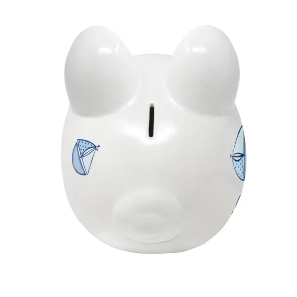 White piggy bank with blue sailboats on a white background