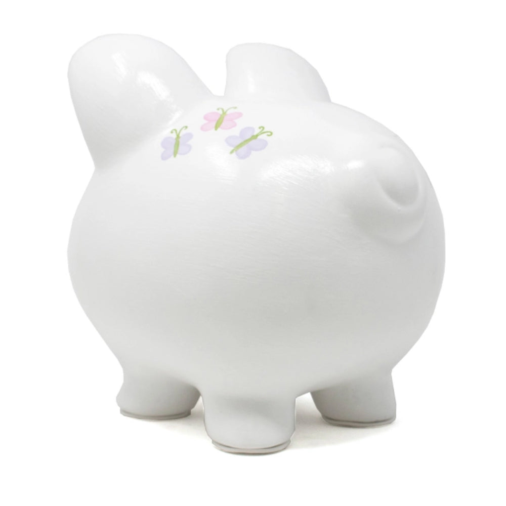A glossy white ceramic piggy bank with three small pastel butterflies on its back, set against a plain white background.