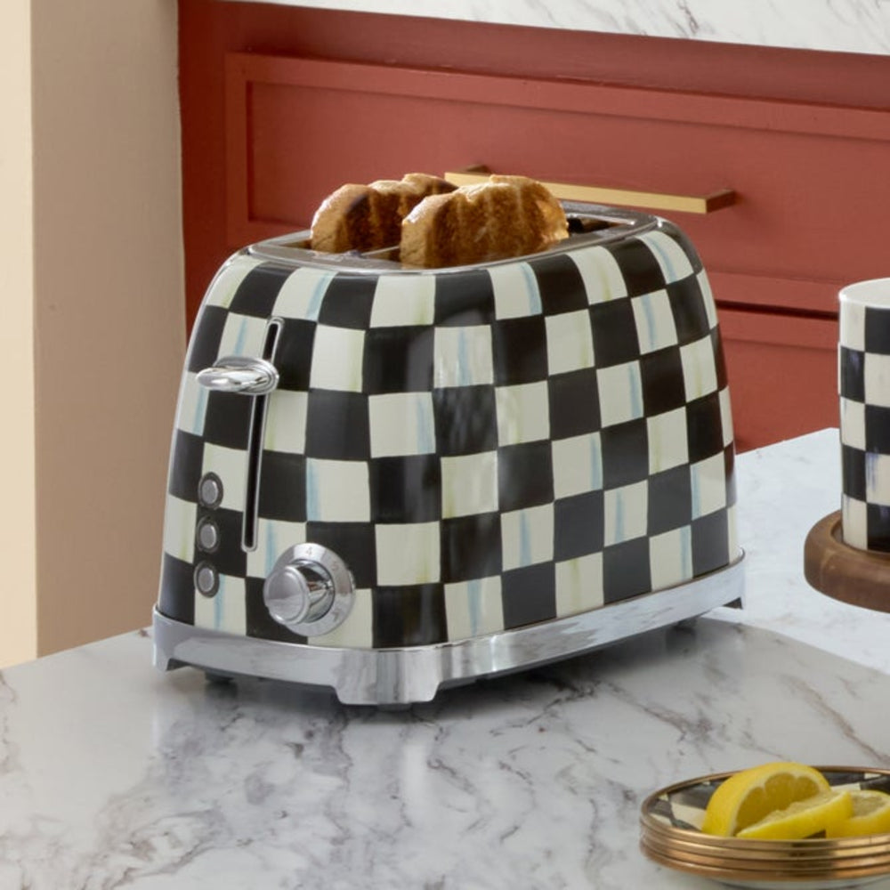 Checkered toaster with bread on a marble countertop