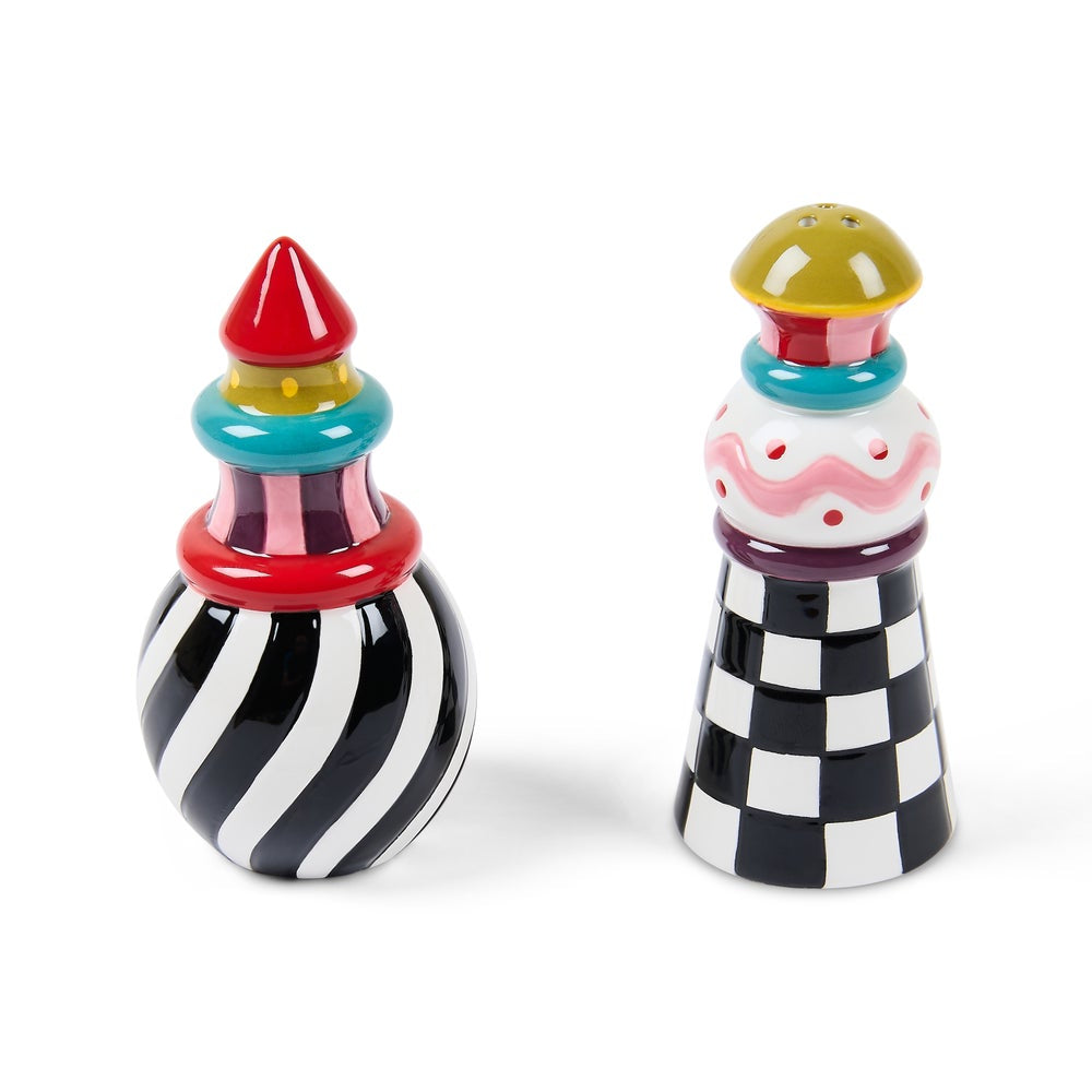 Colorful salt and pepper shakers with striped and checkered patterns on a white background
