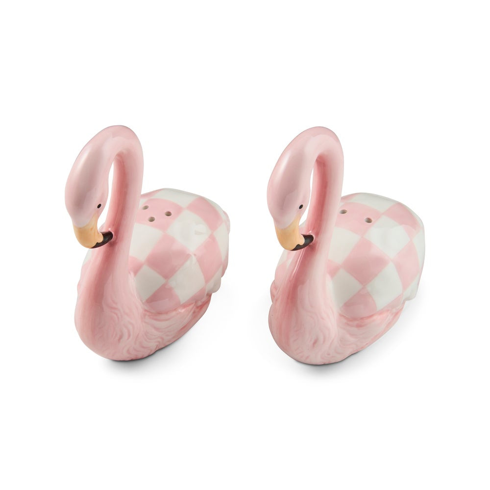 A pair of pink flamingo-shaped salt and pepper shakers with a pink and white argyle pattern on their bodies, set against a plain white background.