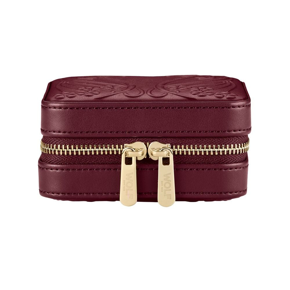 Maroon jewelry box with gold zipper on a white background