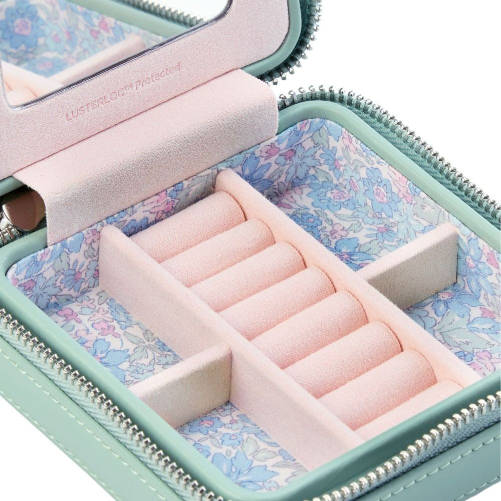 Jewelry case with pink interior and floral patterned lining