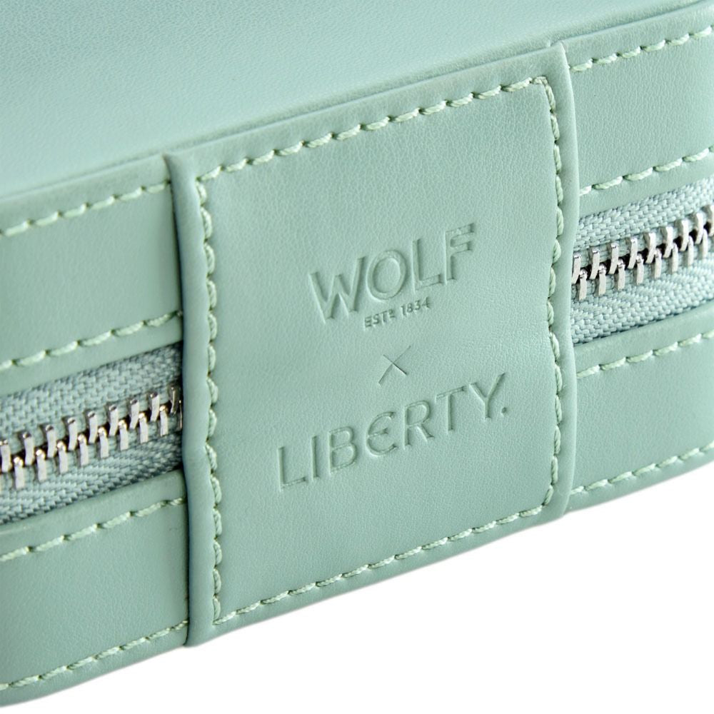 Light blue wallet with 'Wolf' and 'Liberty' branding on a white background