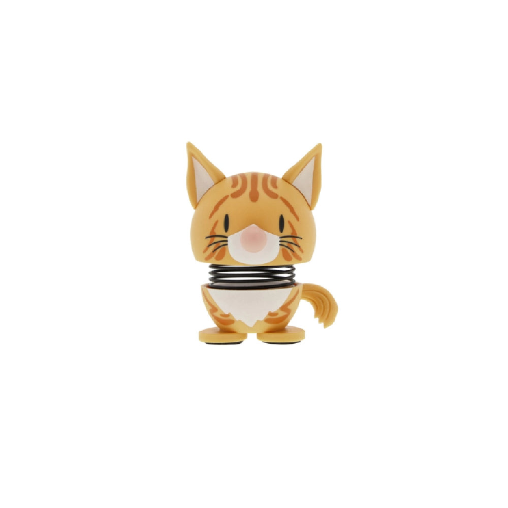 Orange tabby cat figurine on a white backround 