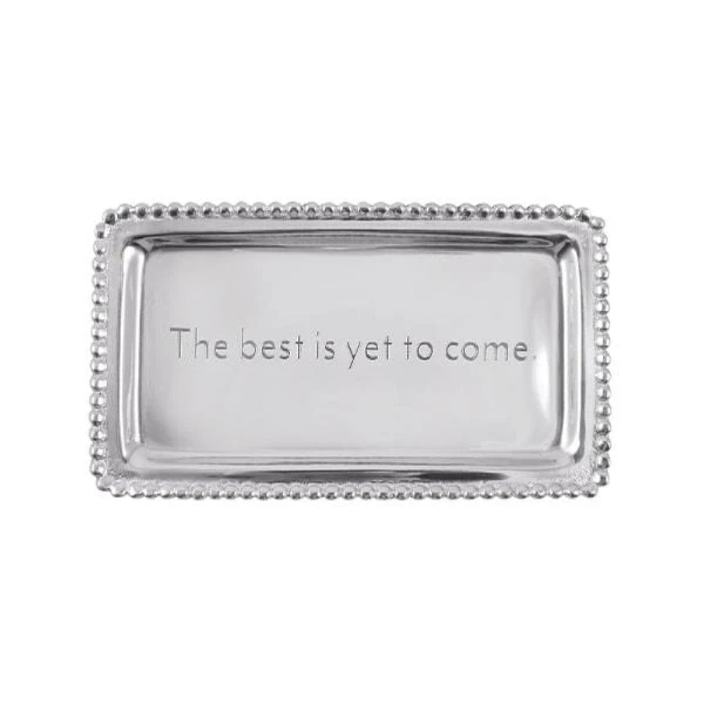 A rectangular aluminum beaded statement tray with the inscription 'The best is yet to come' on the front, presented against a plain background.