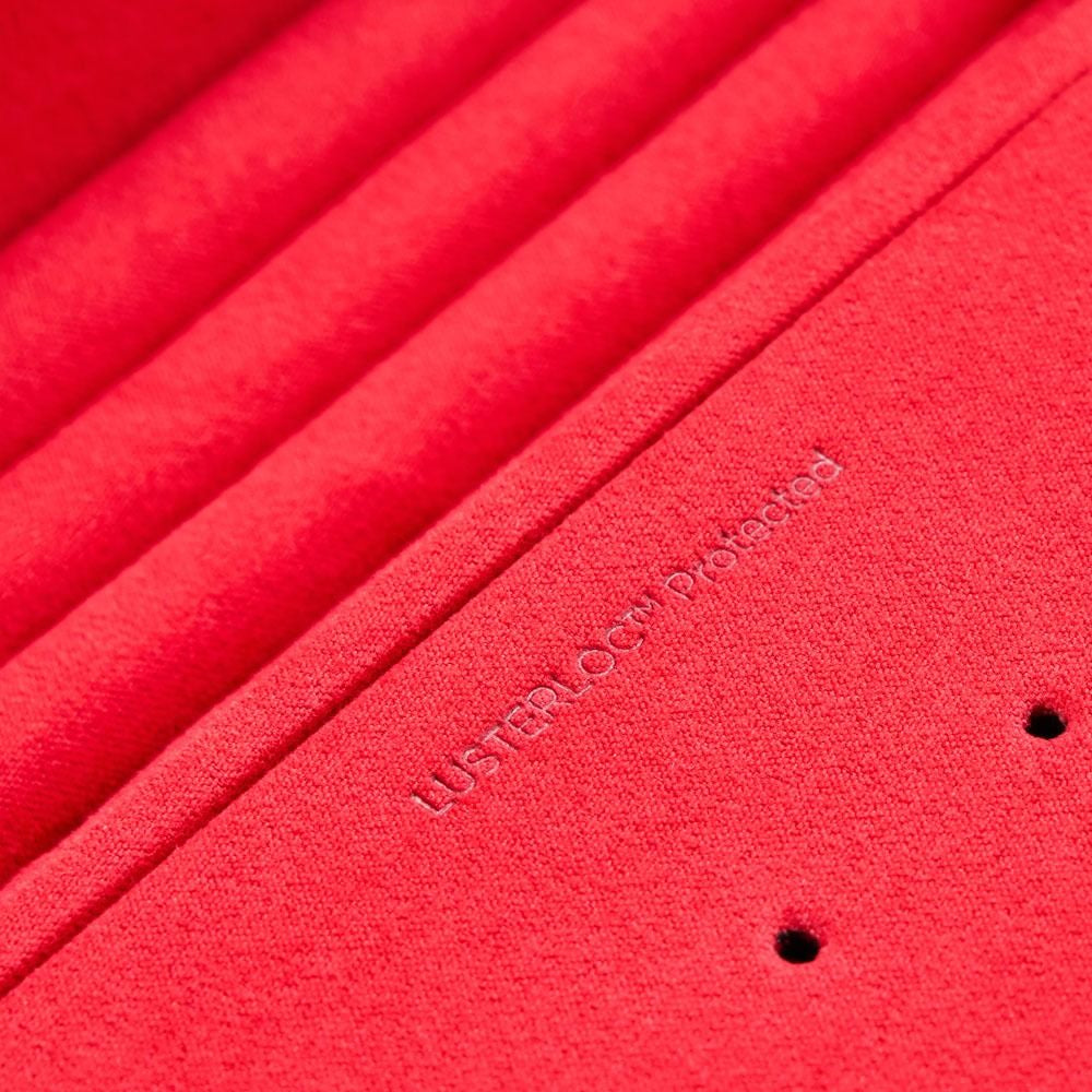 Close-up of a red product with 'Lustrology' branding.