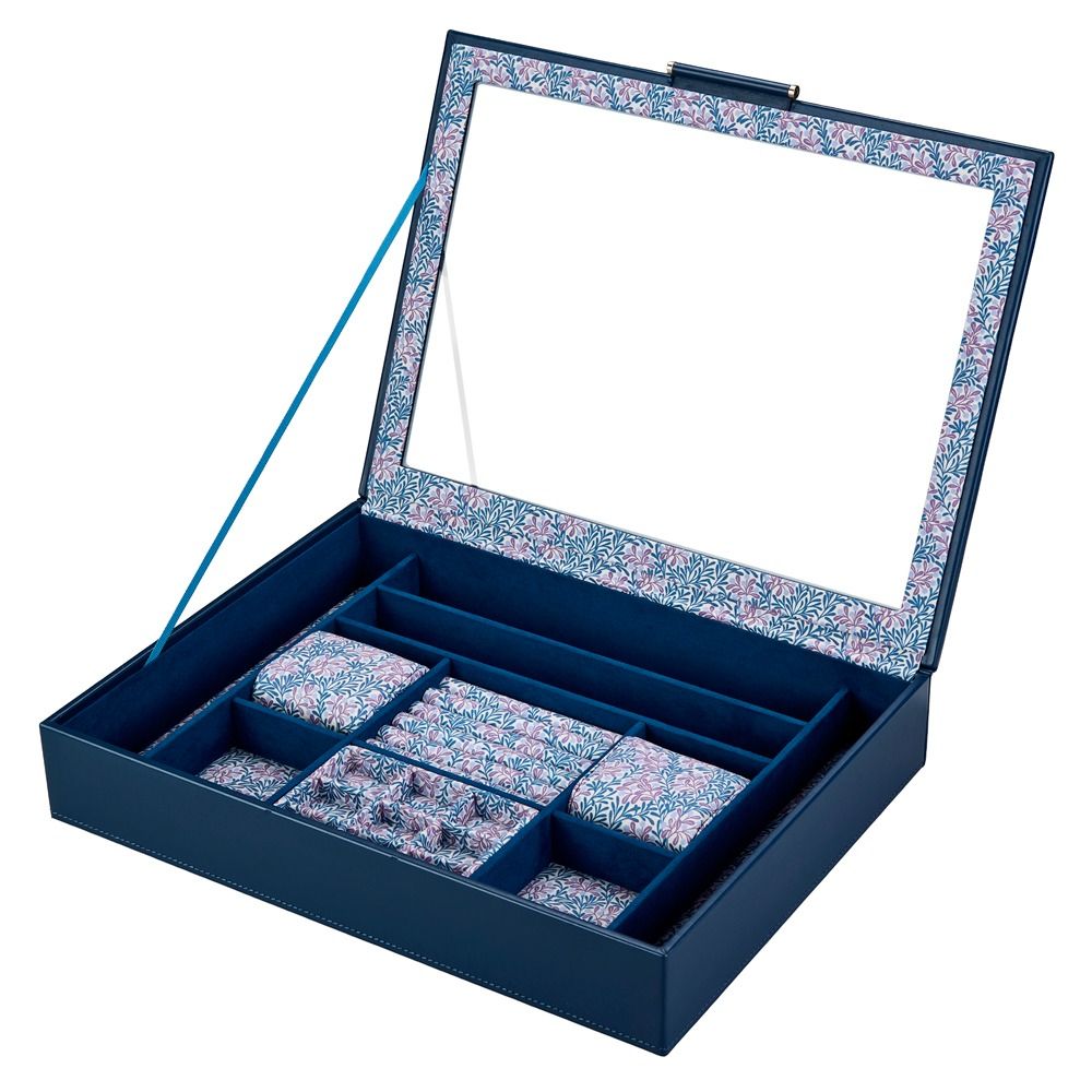 Blue jewelry box with floral interior and compartments on a white background