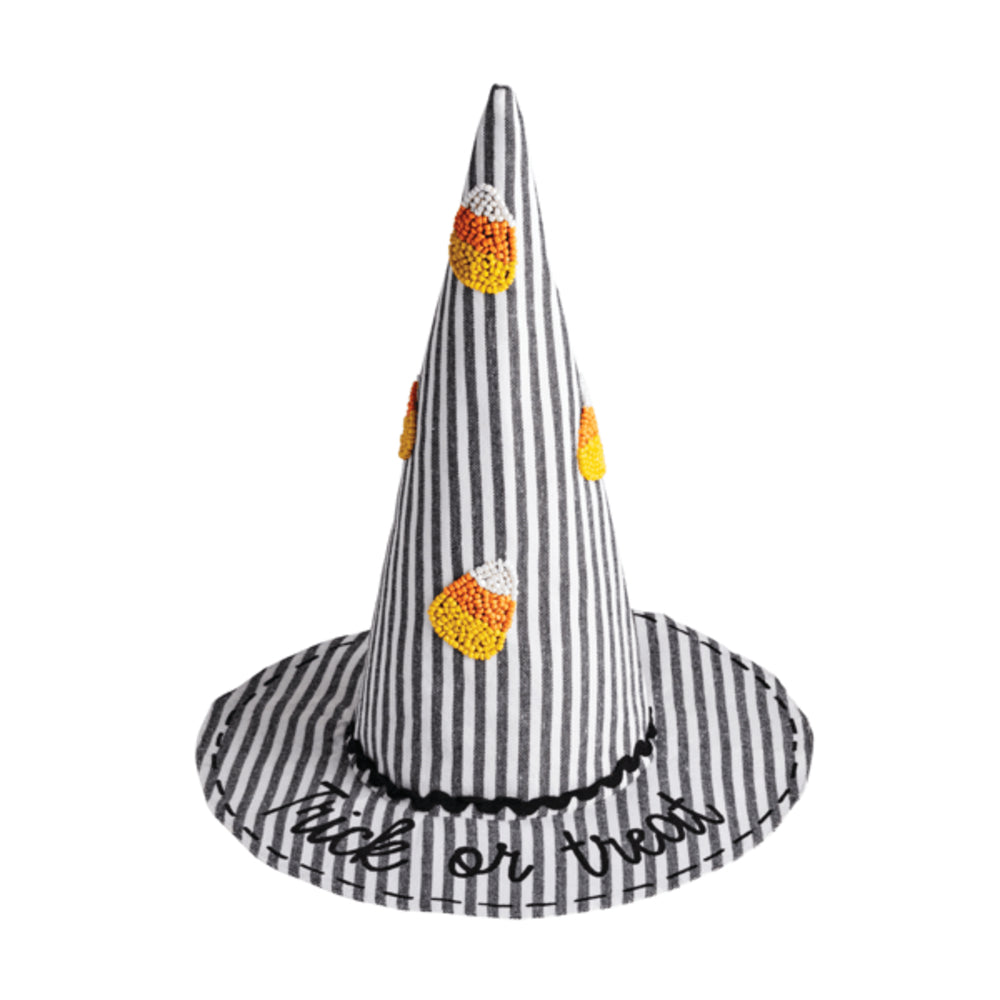Black and white striped witch hat with candy corn decorations on a white background