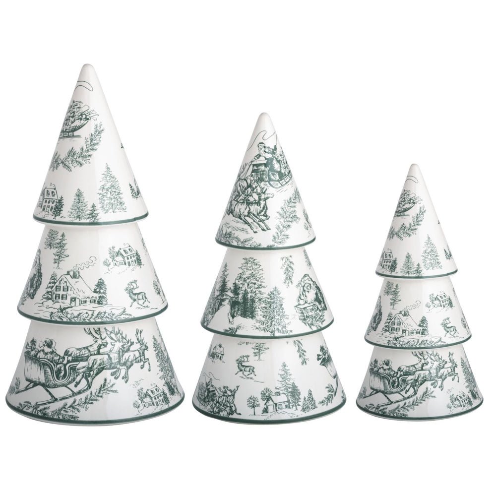 Three stacked Christmas tree-shaped ceramic containers with a green toile de Jouy winter scene pattern on a white background, set against a plain white studio backdrop.