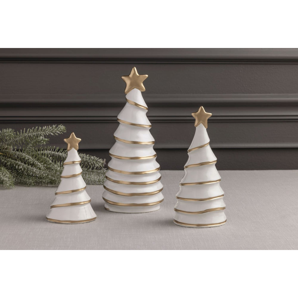 Three white Christmas trees with gold accents and stars on a neutral background.