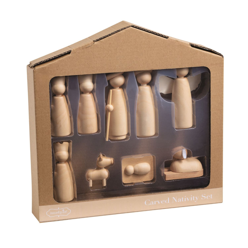 Wooden nativity set in a cardboard packaging on a white background