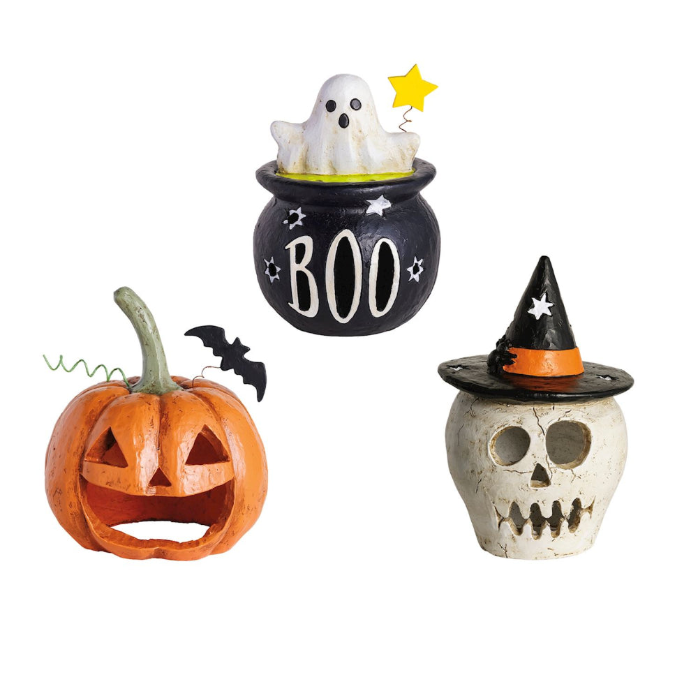 Halloween-themed decorations including a ghost in a cauldron, pumpkin with bats, and skull with witch hat on a white background.