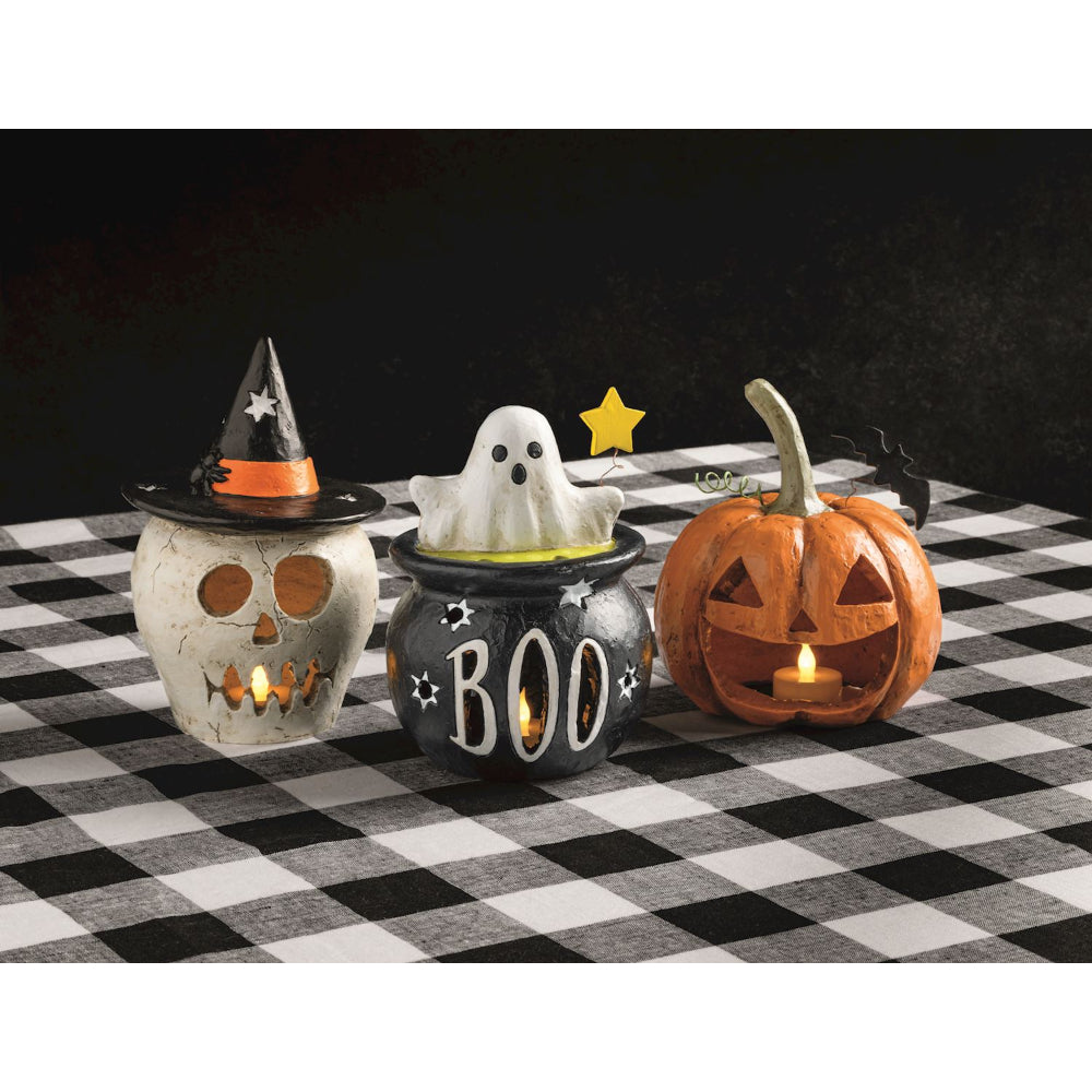 Halloween-themed lanterns on a checkered tablecloth