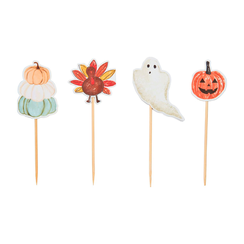 Halloween-themed  thoothpick sets of 24 with pumpkins, stacked pumpkins, ghost, and turkey designs on a white backround. 
