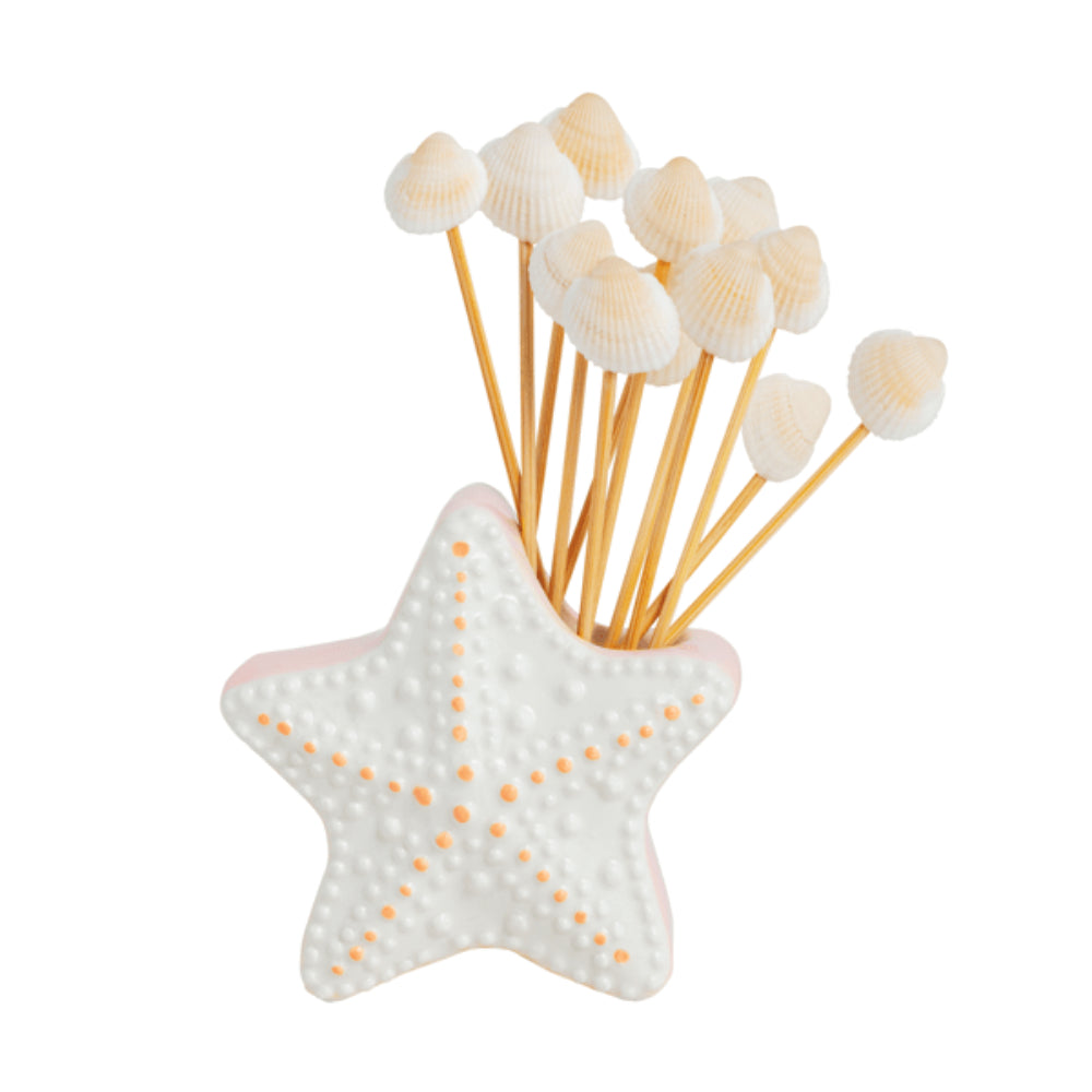 Starfish-shaped holder with toothpicks and white dome-shaped items on a white background