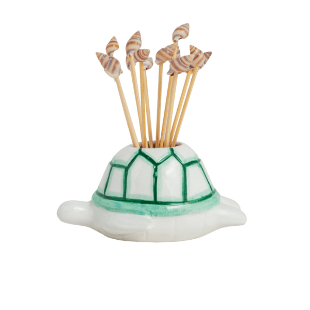 Tortoise-shaped toothpick holder with wooden toothpicks on a white background
